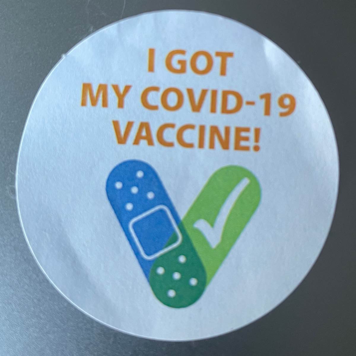 A sticker that says I got vaccined