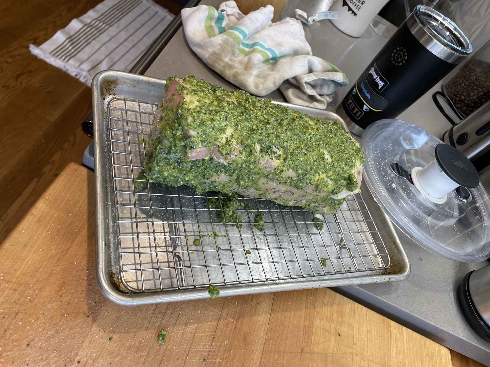 a pork loin rolled up around a green paste of sage and garlic and lemon