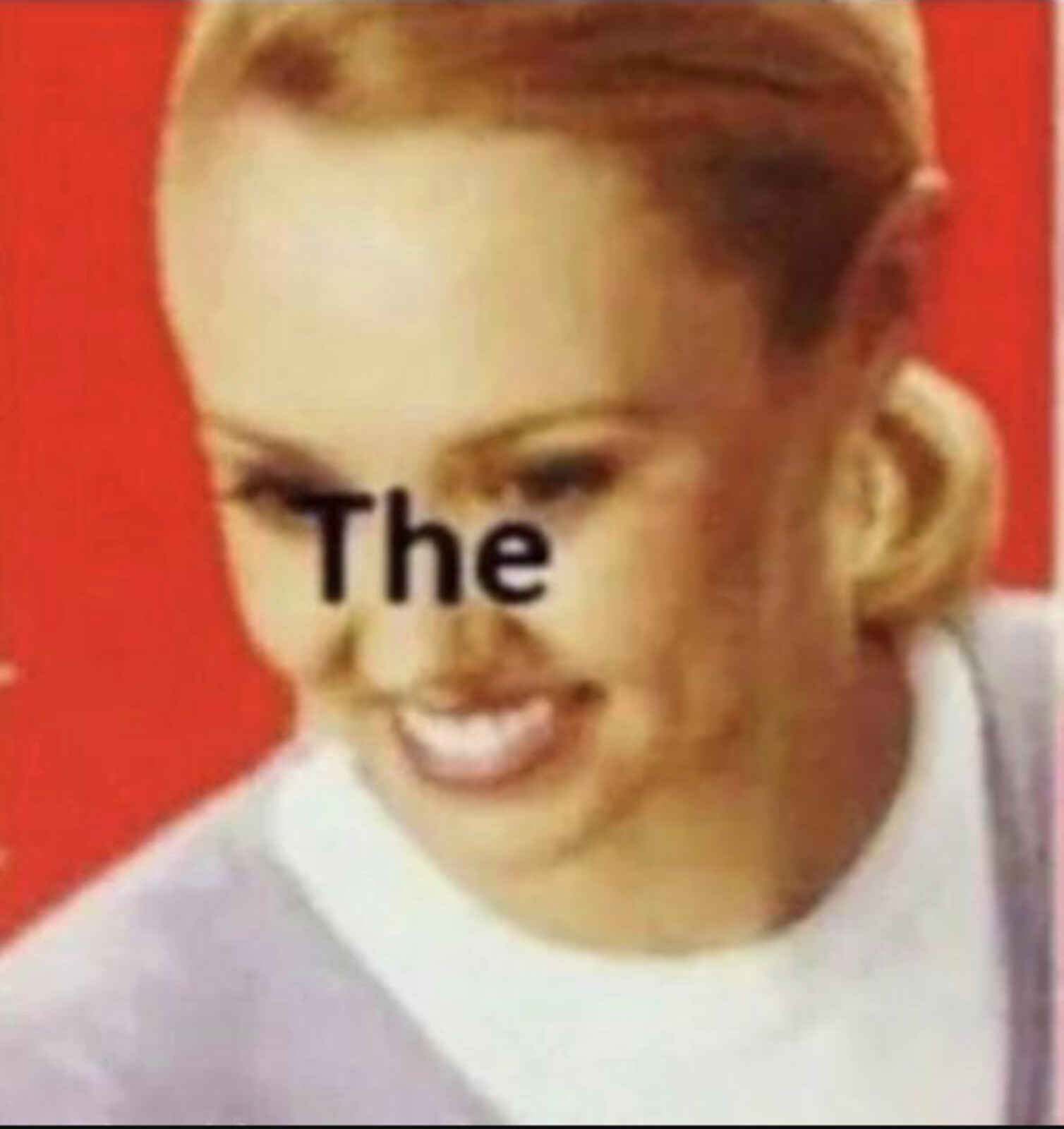a lady with a surprised look on her face with the caption “the”